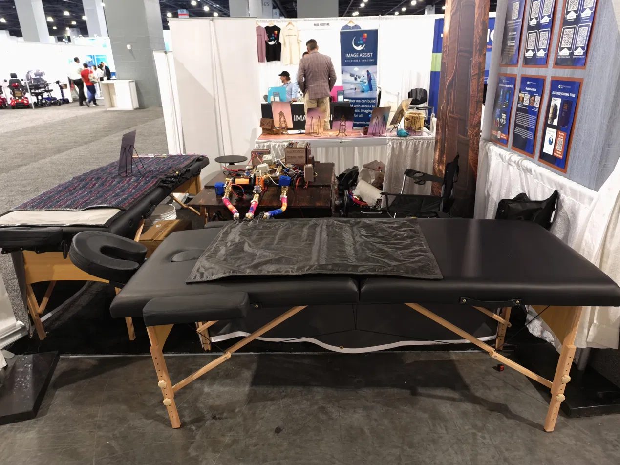 Treatment table and blanket at an exhibition booth